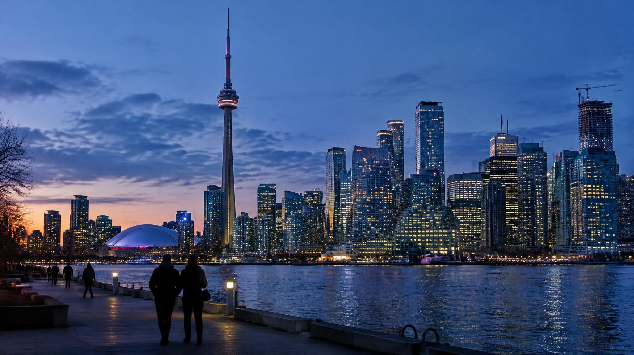 Canadian city skyline at dusk with lit office towers